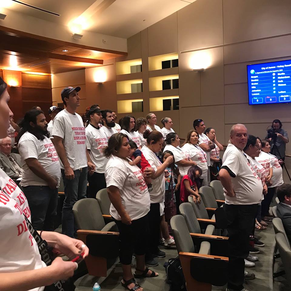 a group of organizers standing in a courtroom